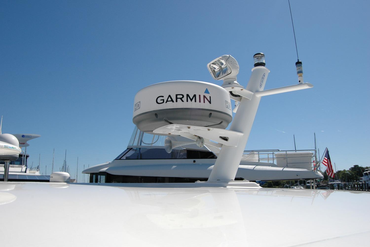 2014 Back Cove 37 yacht with Garmin radar system under clear blue sky.