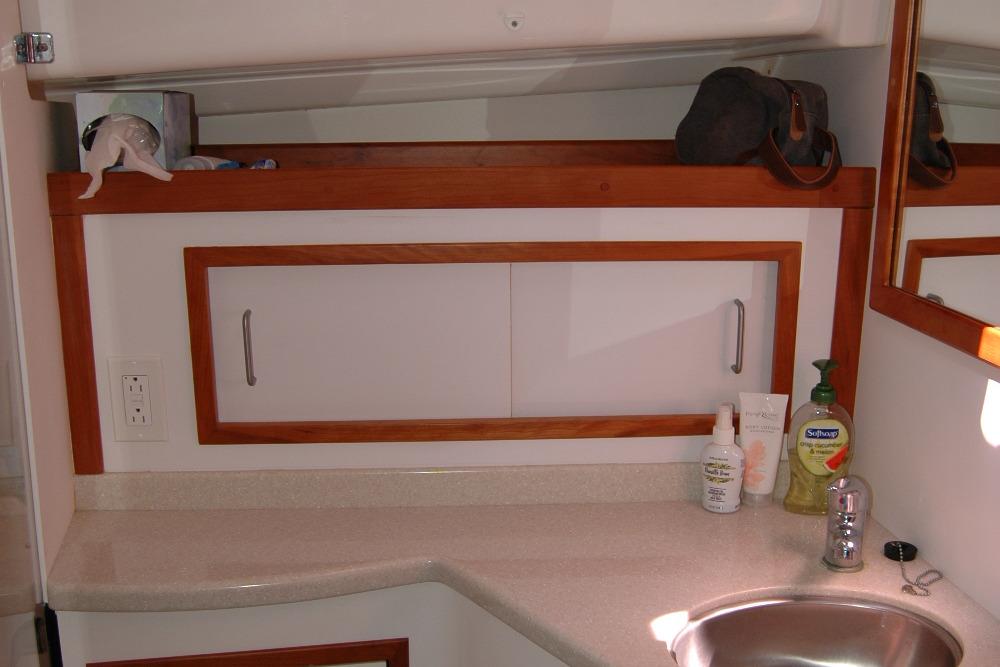 2014 Back Cove 37 yacht bathroom with sink, countertop, and storage cabinet.