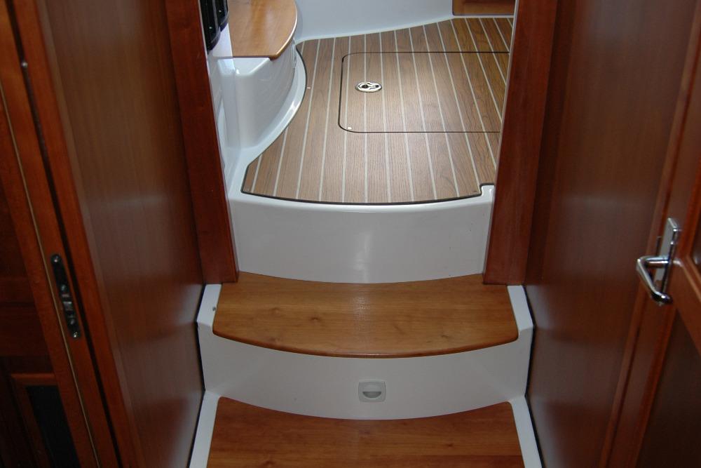 Interior steps of a 2014 Back Cove 37 boat with wooden finish.