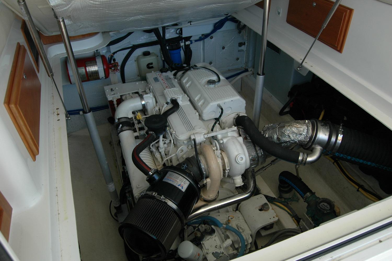Engine room of 2014 Back Cove 37 boat, showcasing detailed mechanical components.