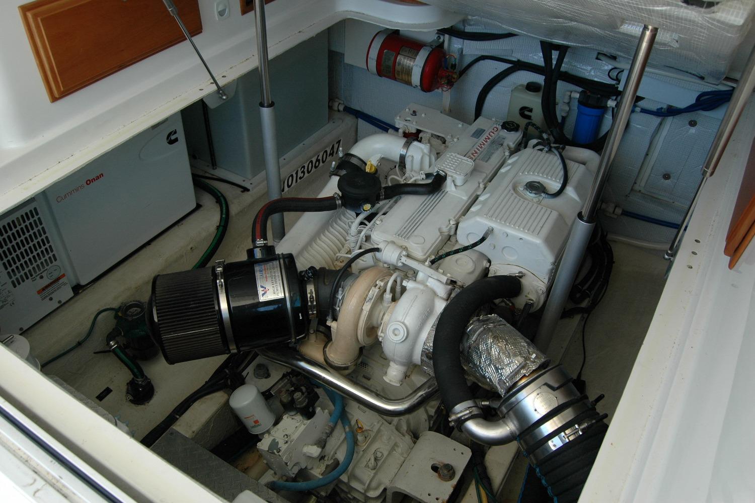 Engine room of a 2014 Back Cove 37 boat, featuring a Cummins engine.