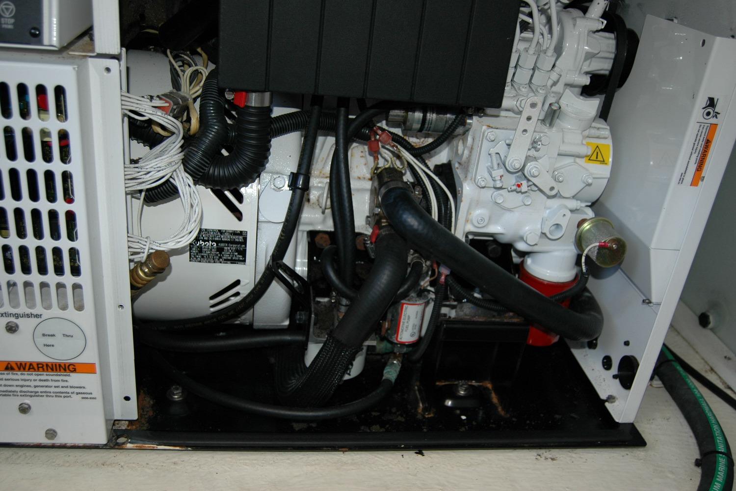 Engine compartment of a 2014 Back Cove 37 boat, showcasing mechanical components and wiring.
