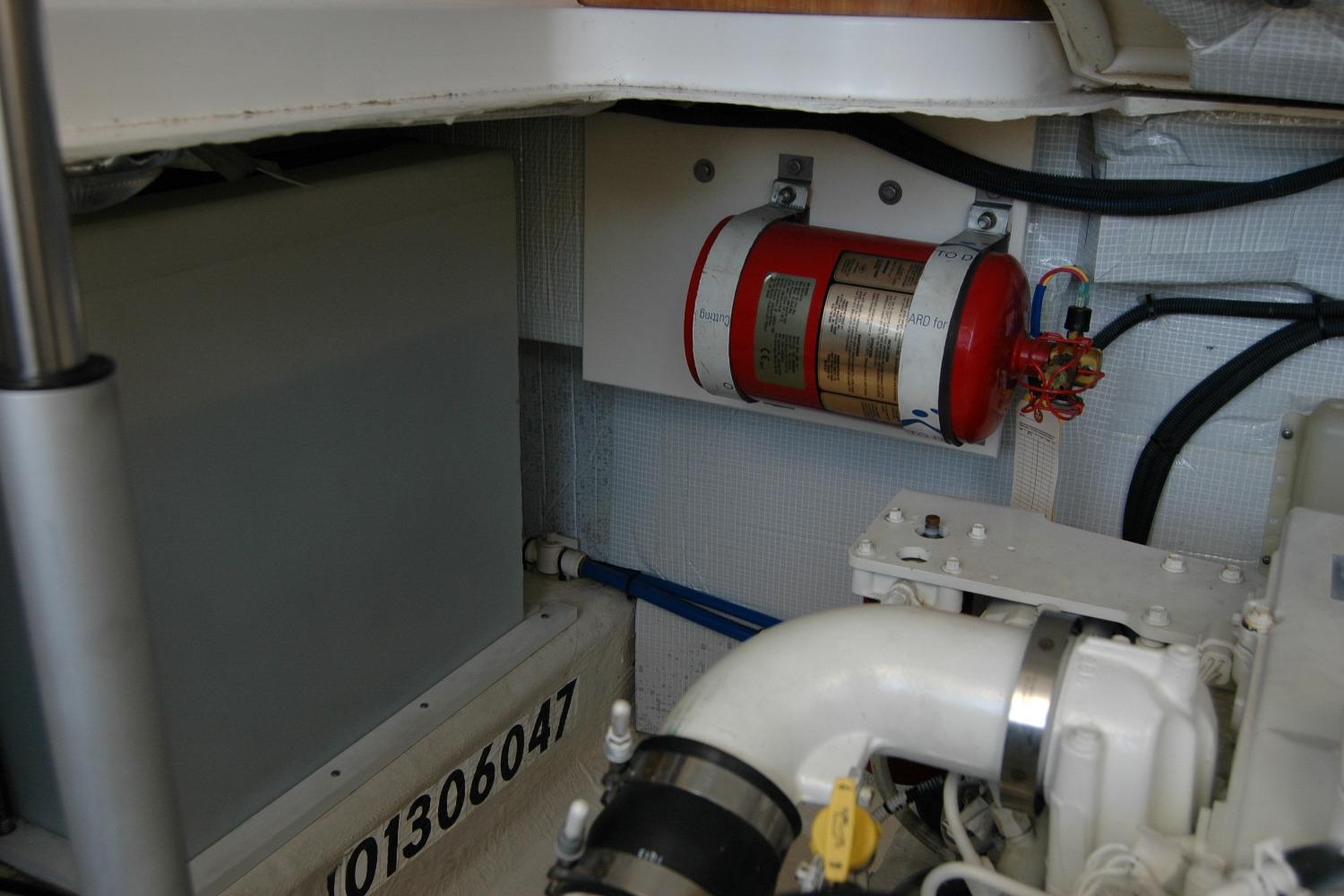 Engine room of 2014 Back Cove 37 with fire extinguisher and equipment.