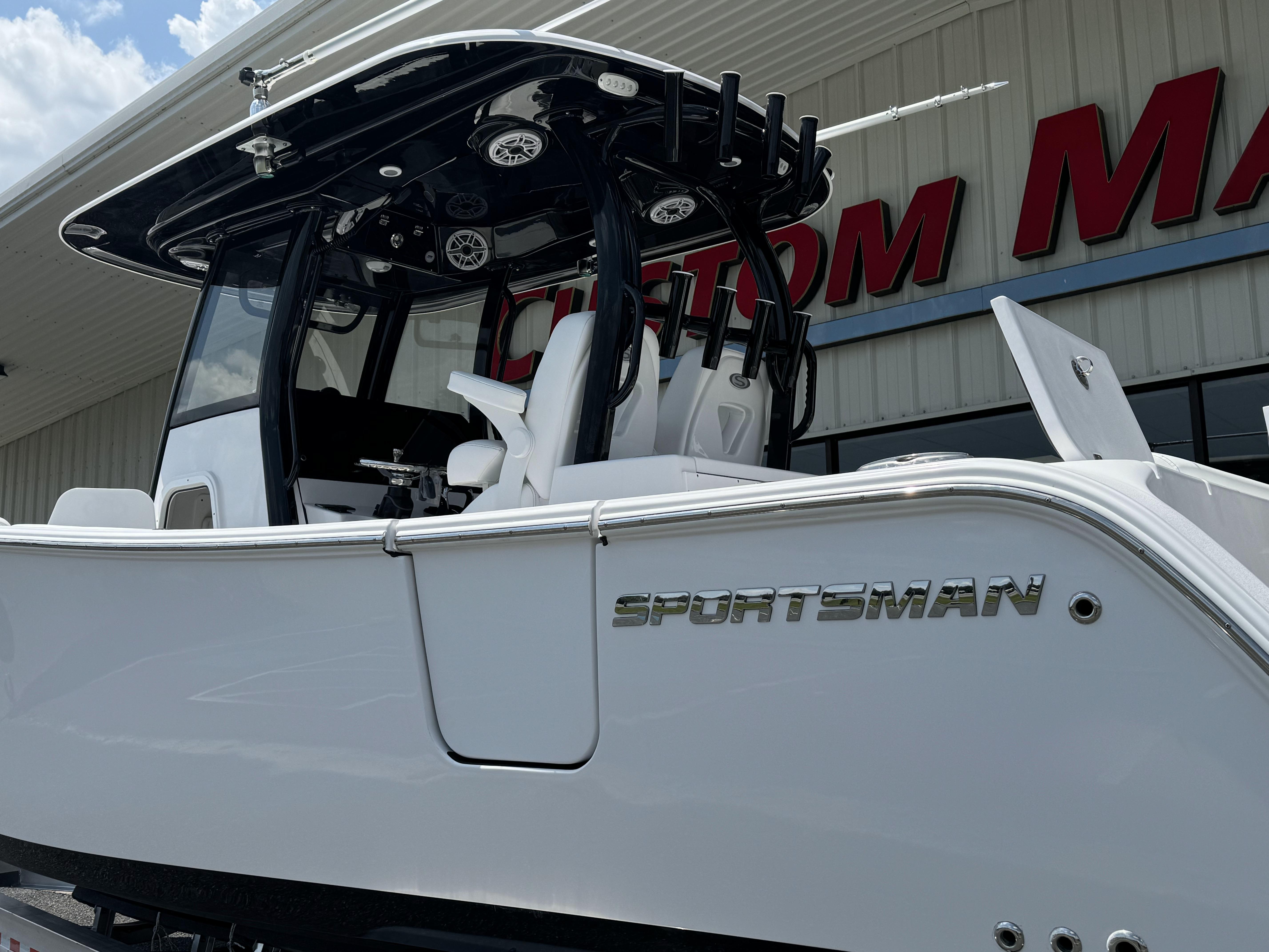 2025 Sportsman Open 282 Center Console boat displayed outside a showroom.