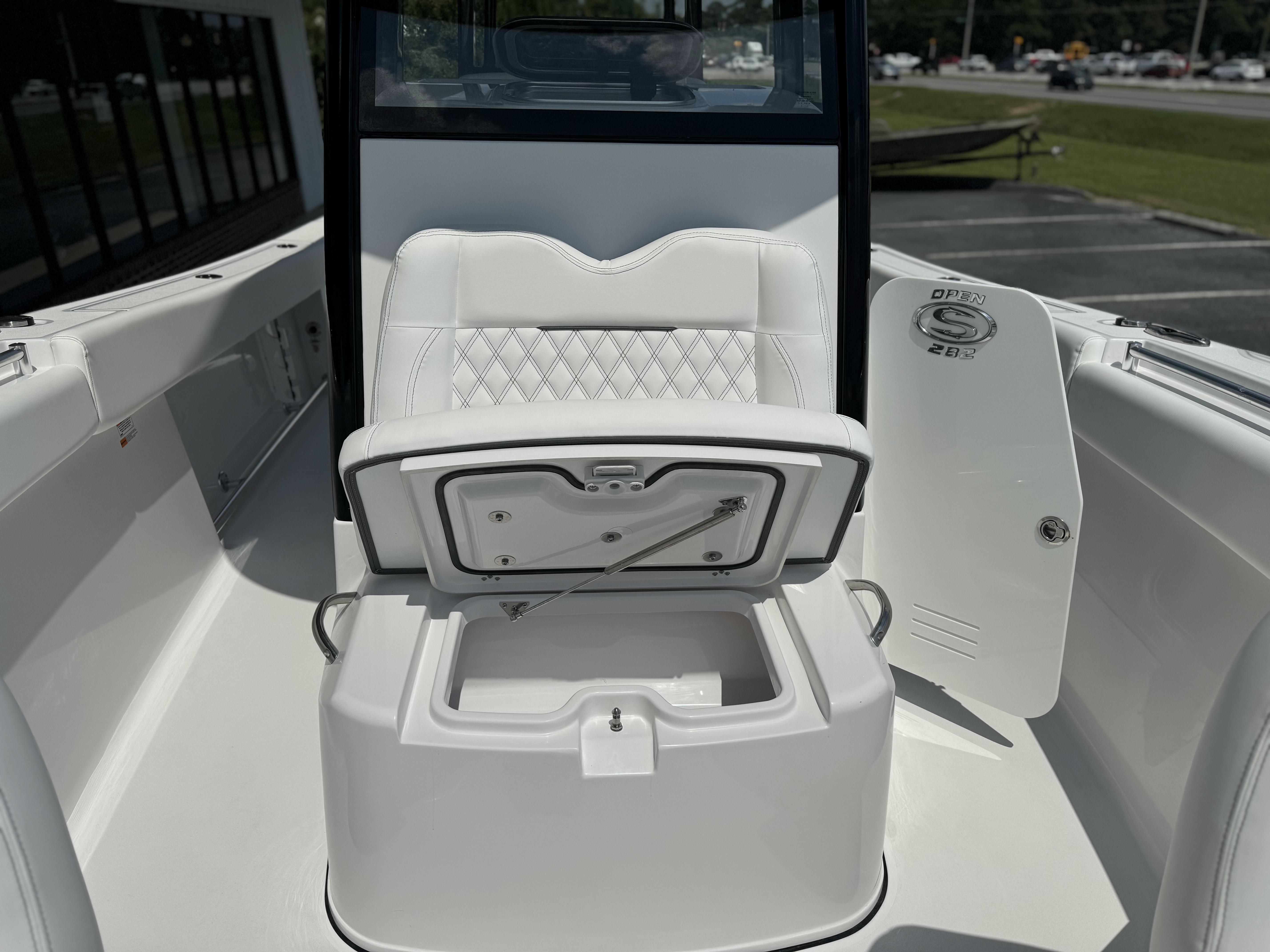 2025 Sportsman Open 282 Center Console boat interior with open storage compartment.