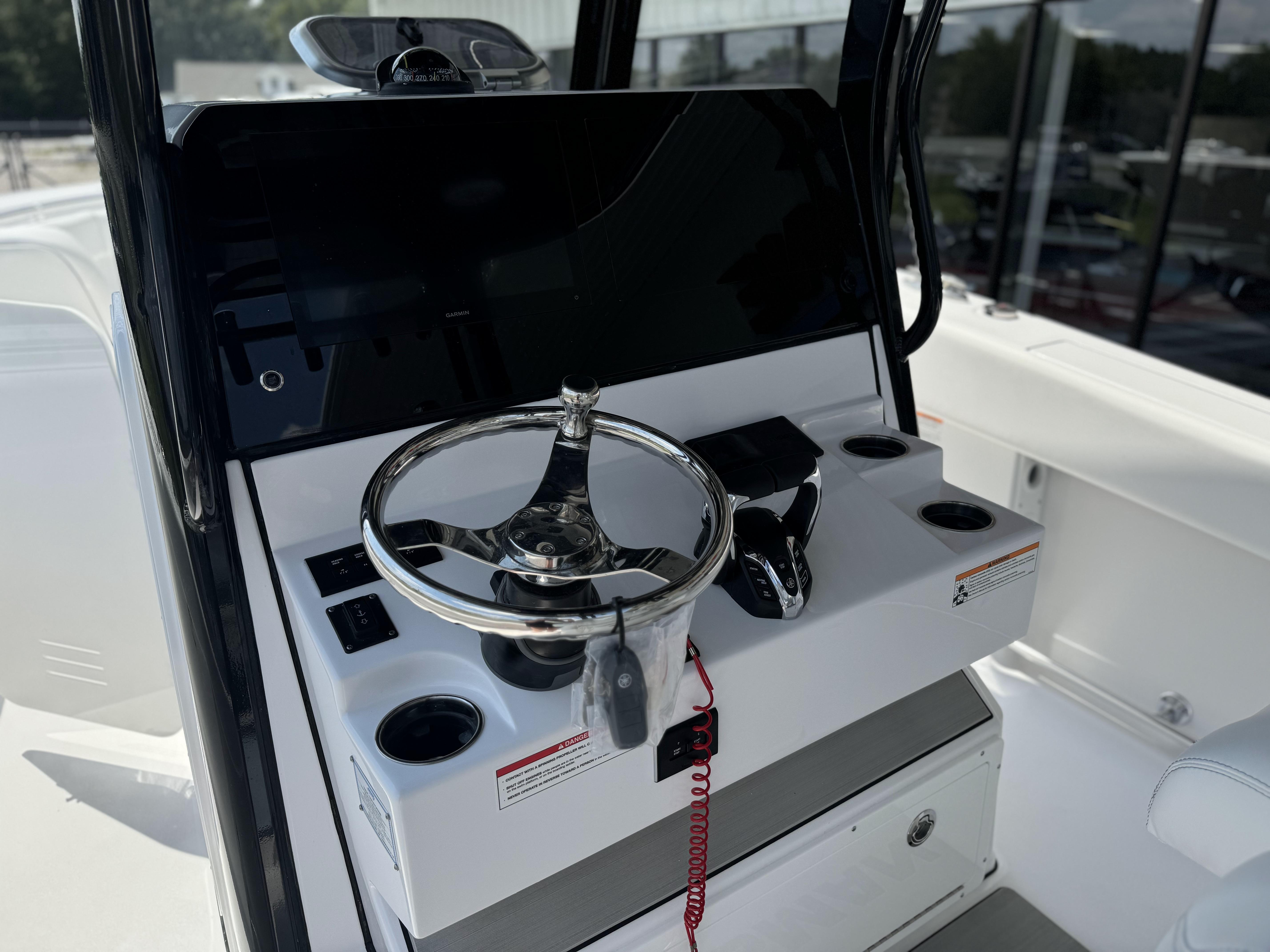 2025 Sportsman Open 282 Center Console steering wheel and dashboard.