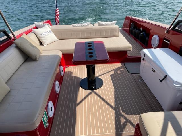 VanDutch-40 2010-Press On Regardless FL-US-Luxurious 2010 VanDutch 40 boat interior with red and beige seating, table, and cooler.-8699189 | Thumbnail