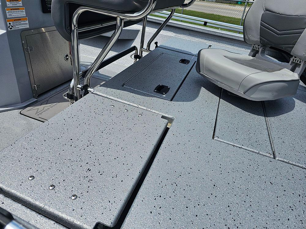 2023 Xpress H20B boat interior with gray seating and textured flooring.