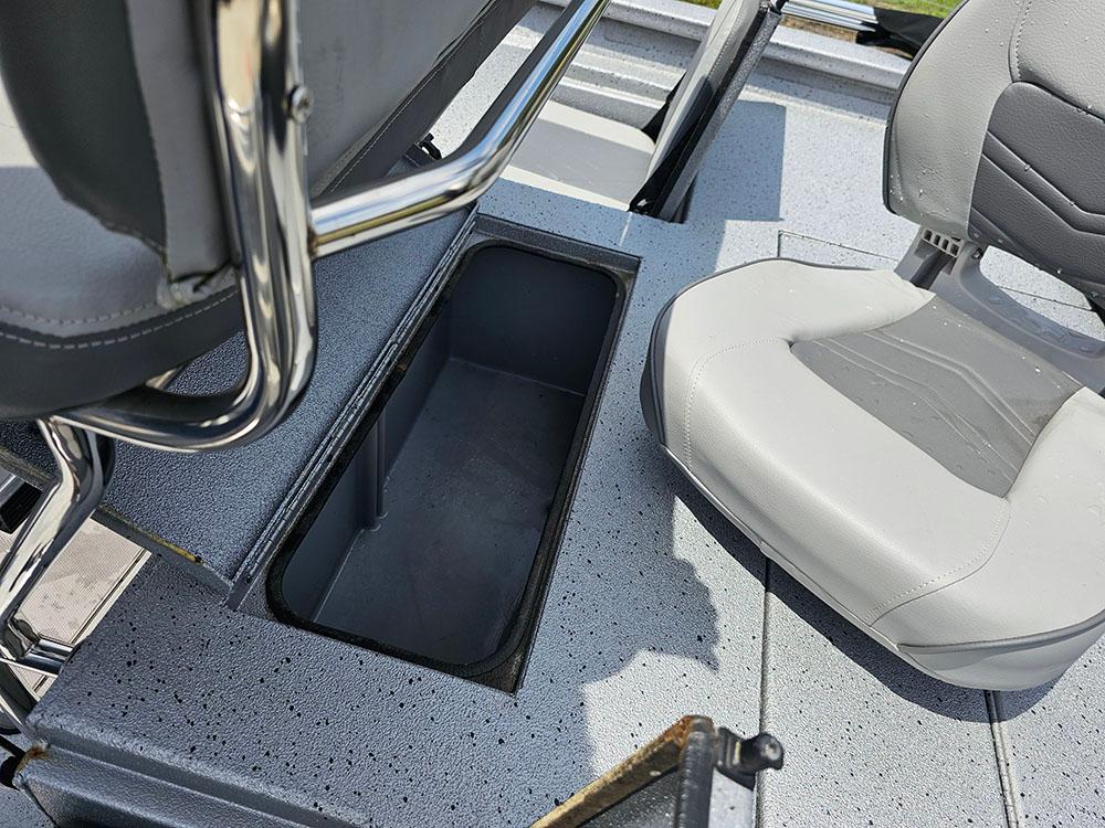 2023 Xpress H20B boat interior with storage compartment and seating.