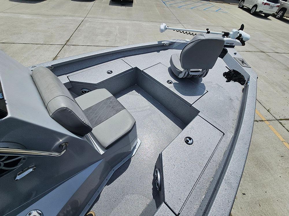 2023 Xpress H20B boat interior with seating and fishing equipment.