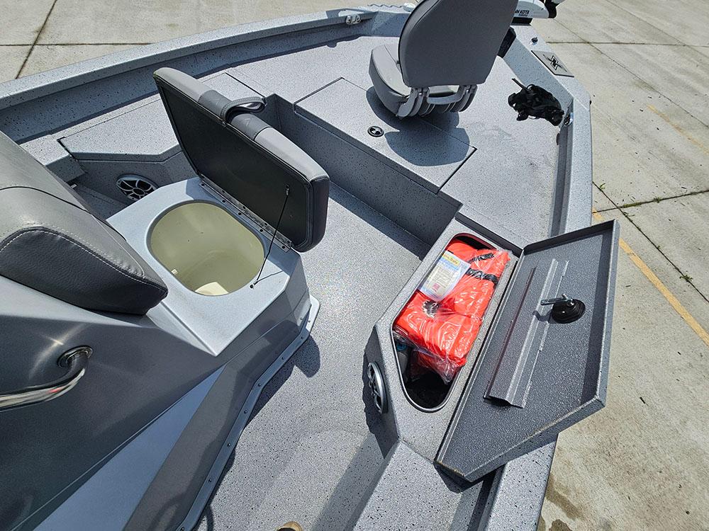2023 Xpress H20B boat interior with storage compartments and seating.