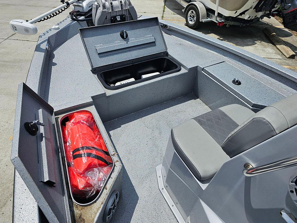2023 Xpress H20B boat interior with storage compartments and seating.