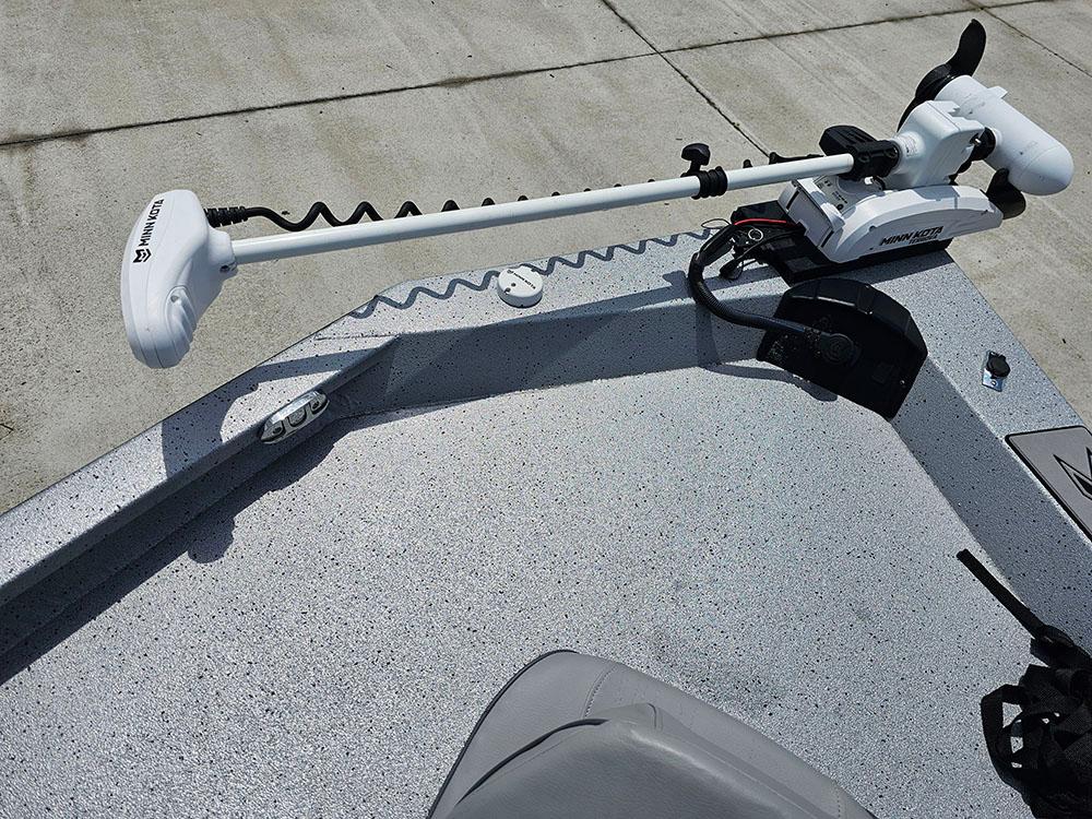 2023 Xpress H20B boat with Minn Kota trolling motor on deck.