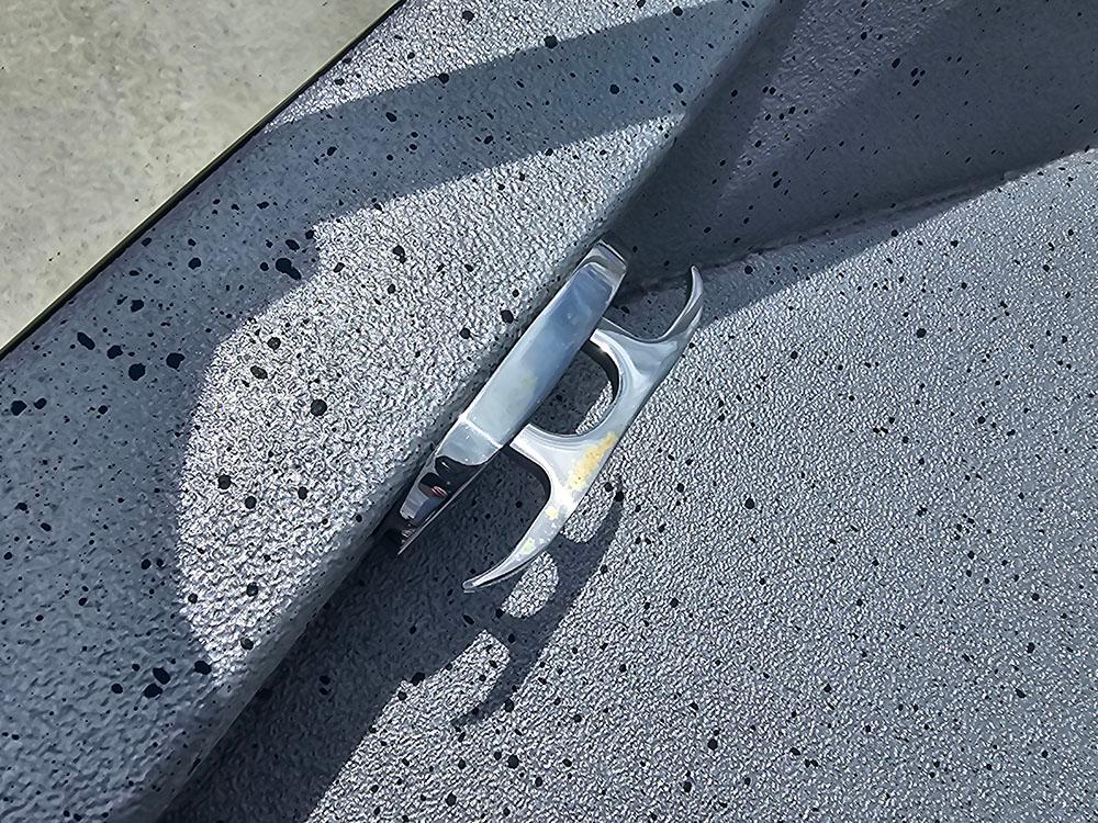 2023 Xpress H20B boat cleat on textured gray surface.