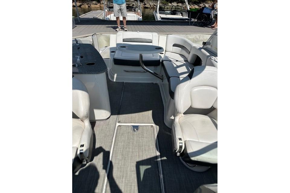 2016 Chaparral 264 Sunesta boat interior with white seating and deck view.