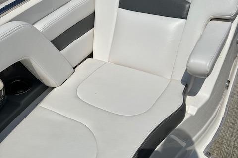 2016 Chaparral 264 Sunesta boat seat with white and gray upholstery.
