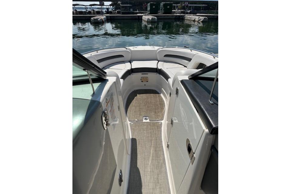 2016 Chaparral 264 Sunesta boat interior with seating and open deck view.