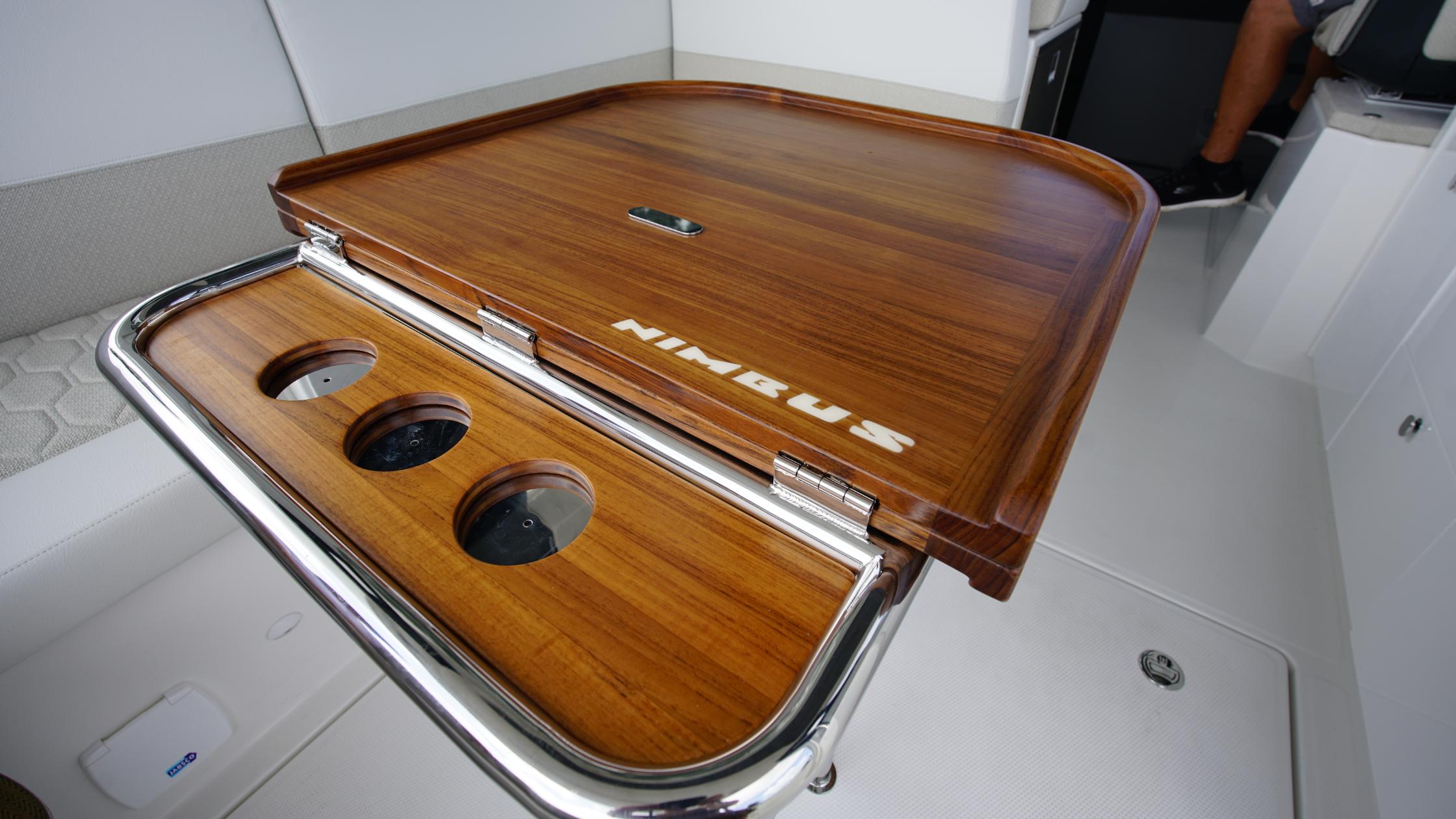 Nimbus-Weekender 11 #60 2025-In-Stock 2025 Nimbus W11 #60 FL-US-Wooden table on Nimbus Weekender 11 #60 boat, 2025 model, with cup holders.-9829239 | Thumbnail