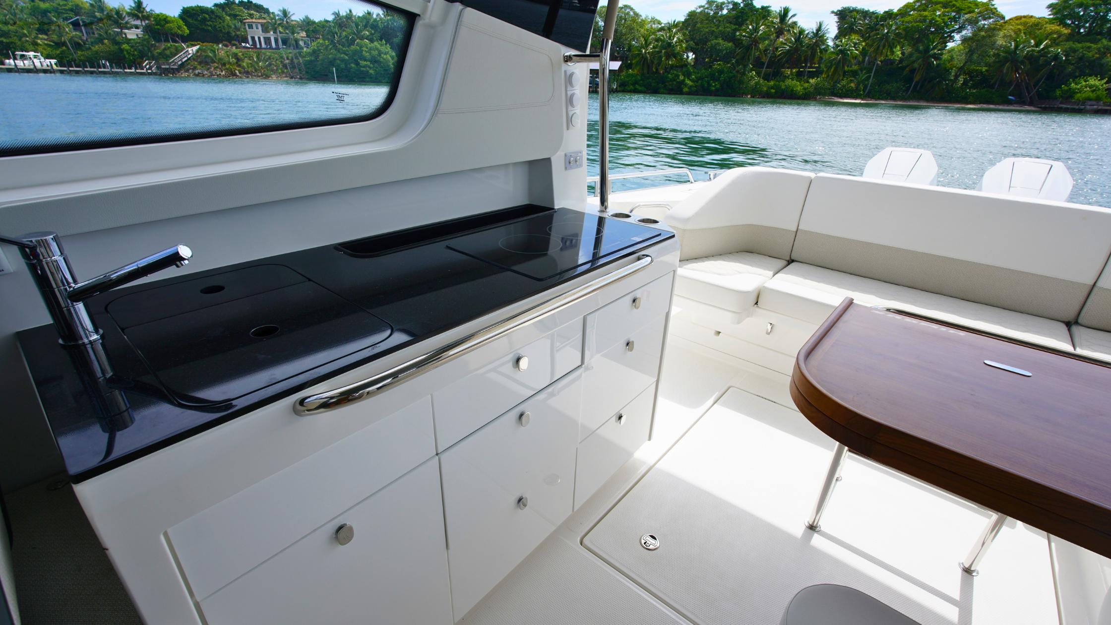 Nimbus-Weekender 11 #60 2025-In-Stock 2025 Nimbus W11 #60 FL-US-Luxurious interior of 2025 Nimbus Weekender 11 yacht with sleek kitchen and seating area.-9829239 | Thumbnail