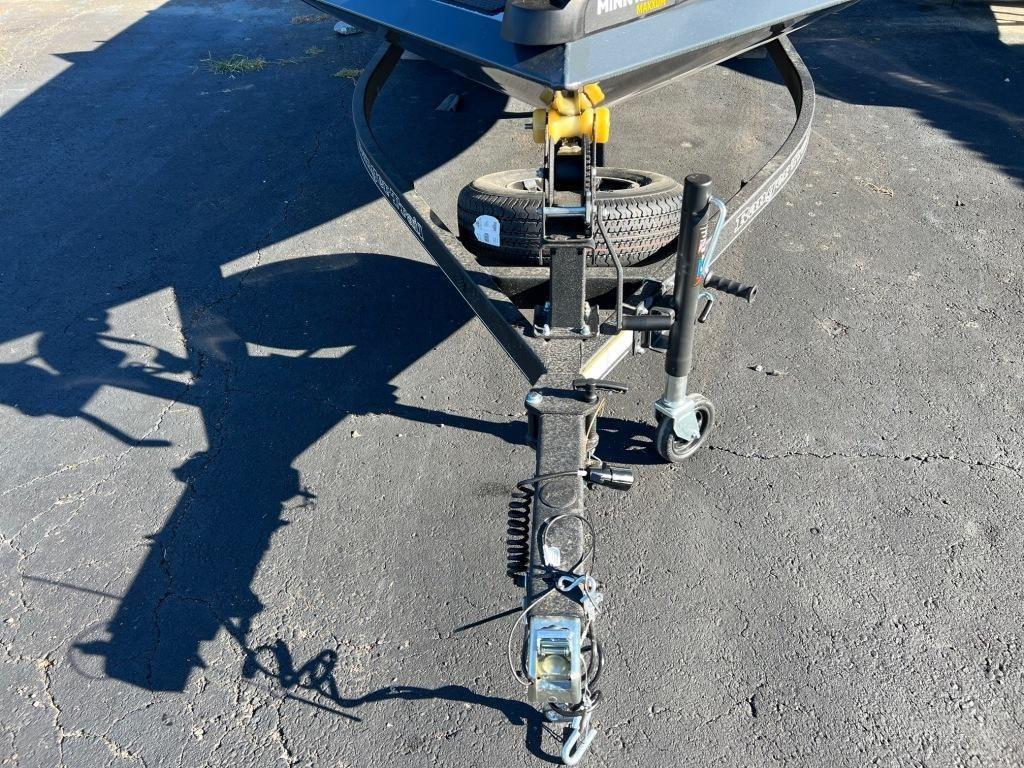2023 Ranger RT198P trailer hitch with spare tire on asphalt.