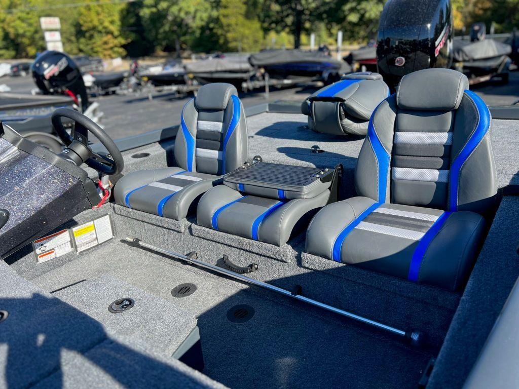 2023 Ranger RT198P boat interior with blue and gray seating, steering wheel, and console.