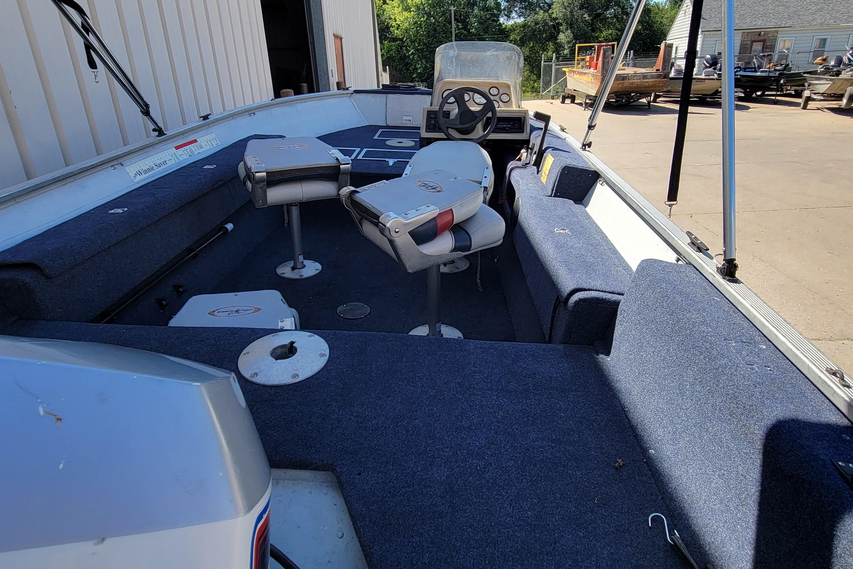 1997 Sea Nymph 168 DLX boat interior with seating and steering console.