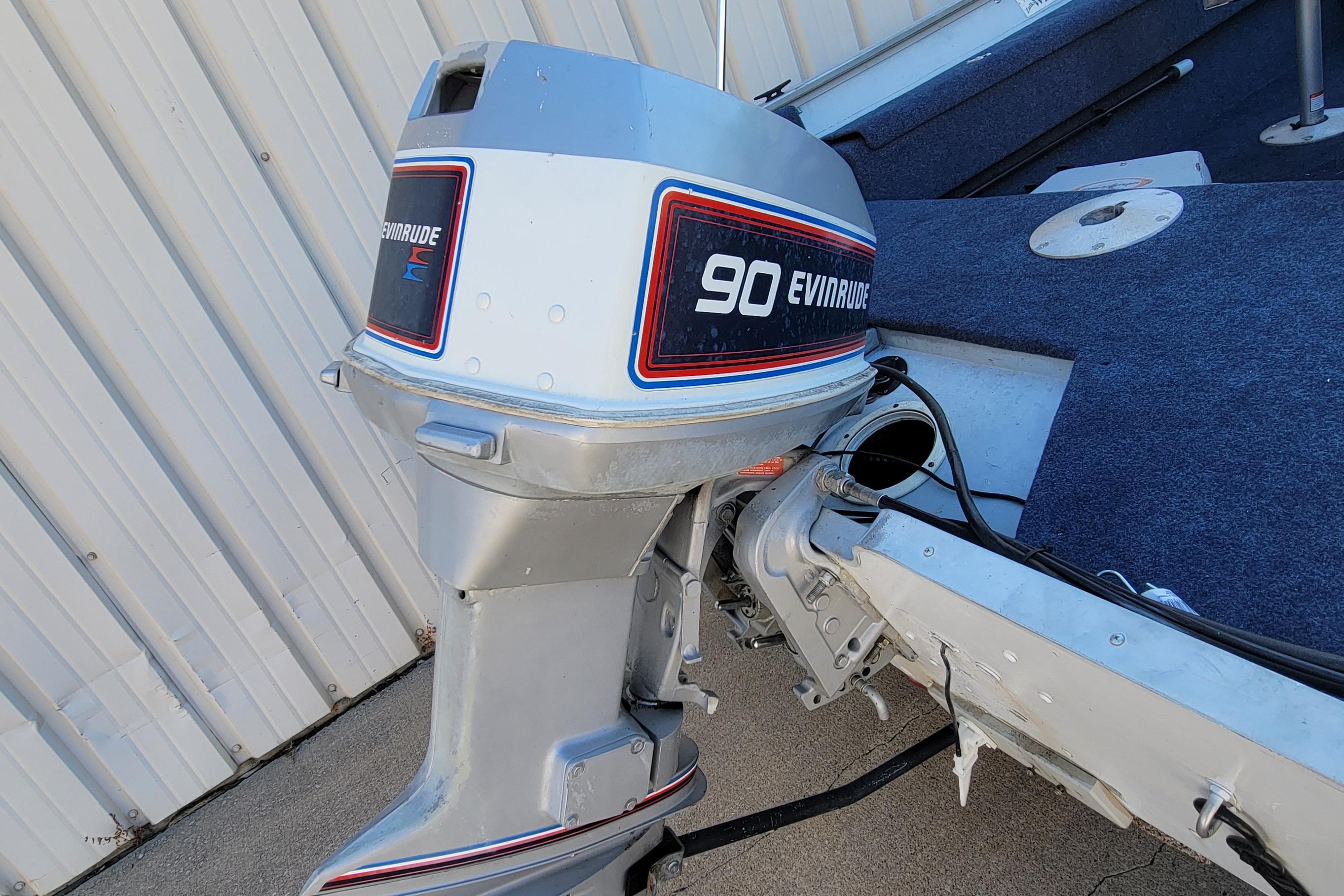 1997 Sea Nymph 168 DLX boat with Evinrude 90 outboard motor, docked.