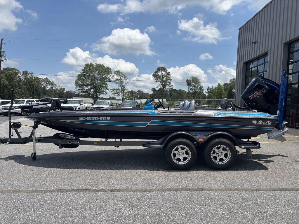2023 Bass Cat Cougar FTD boat on trailer, parked outdoors under a cloudy sky.