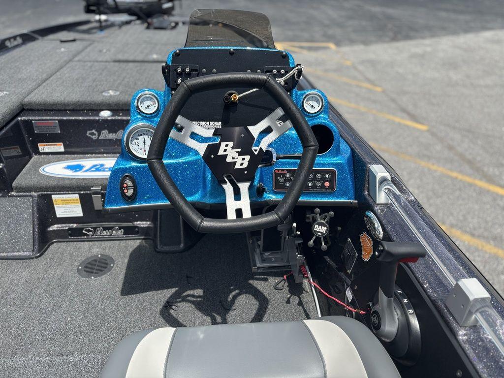 2023 Bass Cat Cougar FTD boat dashboard with steering wheel and gauges.