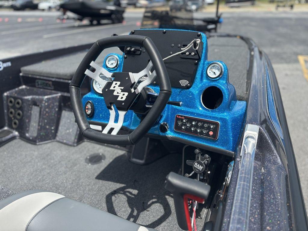 2023 Bass Cat Cougar FTD boat dashboard with steering wheel and control panel.