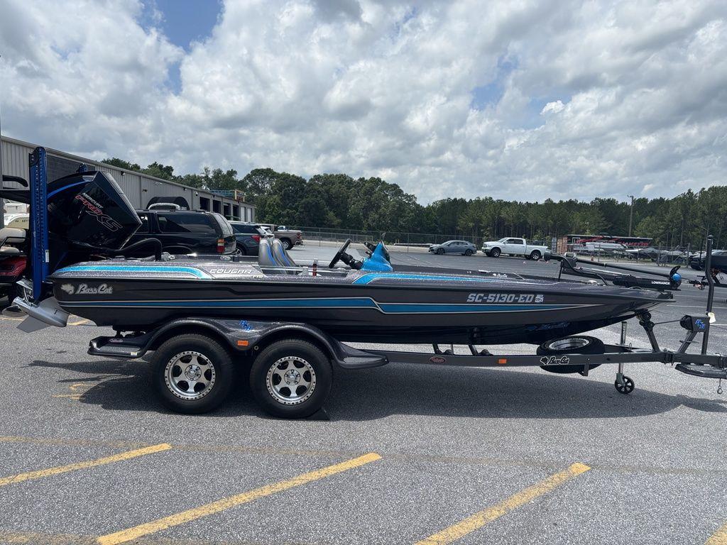 2023 Bass Cat Cougar FTD boat on trailer in parking lot under cloudy sky.