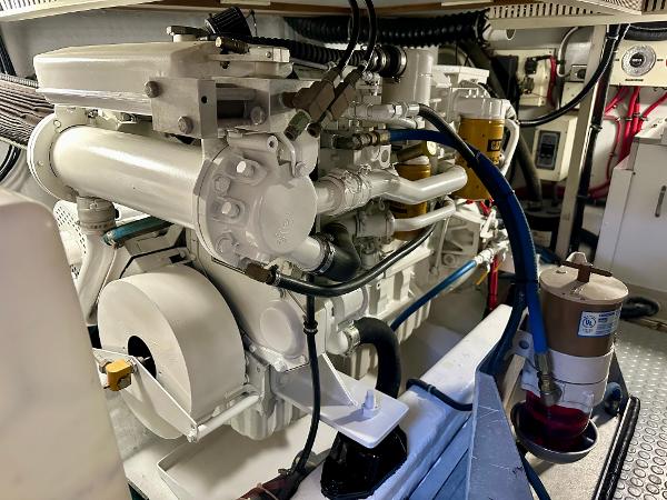 Engine room of a 1997 Sabre Cockpit Motor Yacht, showcasing detailed machinery and components.