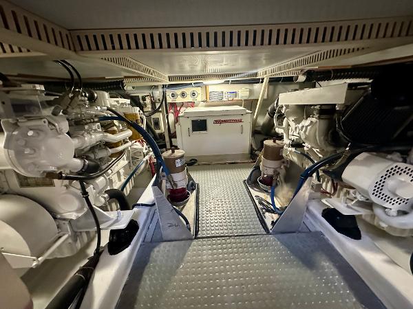 Engine room of a 1997 Sabre Cockpit Motor Yacht, showcasing mechanical components and systems.