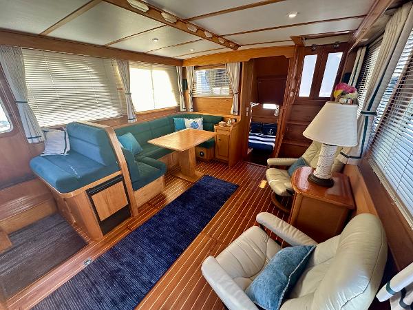 Interior of 1997 Sabre Cockpit Motor Yacht with elegant wood finish and cozy seating.