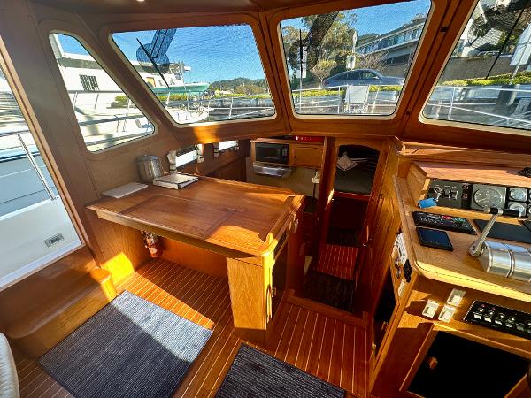 1997 Sabre Cockpit Motor Yacht interior with wooden finishes and navigation equipment.