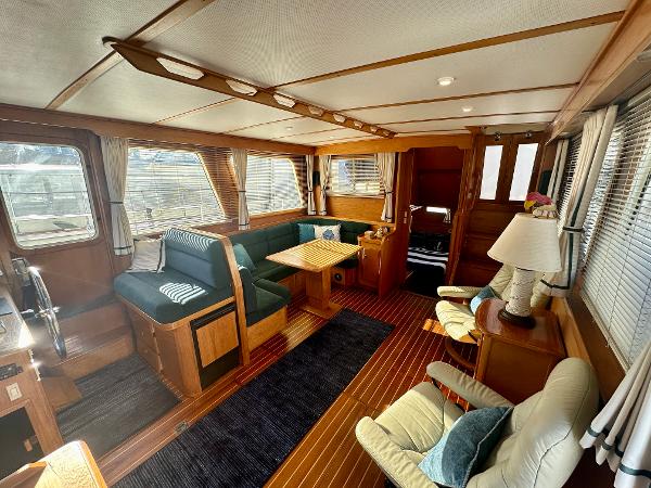 Interior of 1997 Sabre Cockpit Motor Yacht with elegant wood finish and cozy seating.