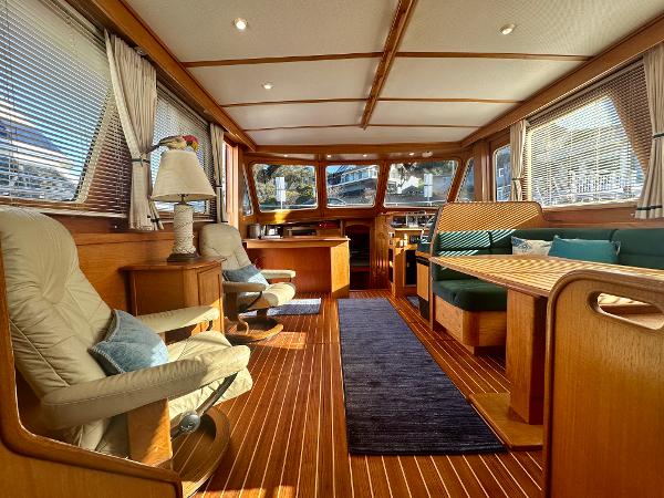Interior of a 1997 Sabre Cockpit Motor Yacht with elegant wood finish and comfortable seating.