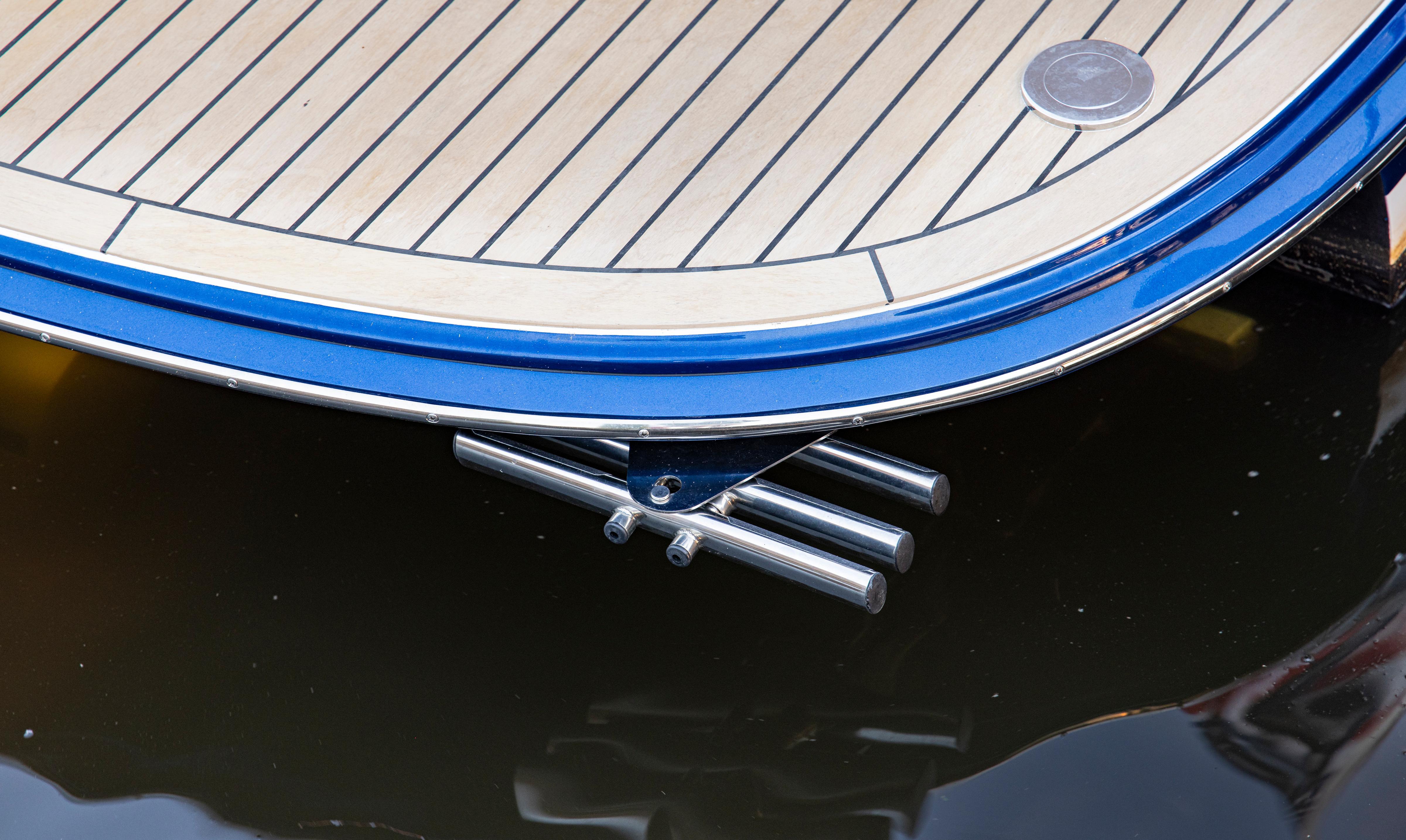 Sleek MJM 42 yacht stern detail with polished metal and wood finish, 2025 model.
