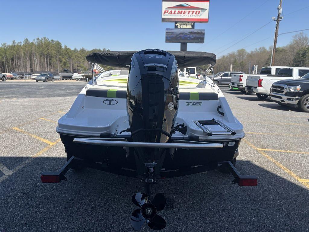 2024 Tahoe T16 boat with outboard motor in a parking lot.