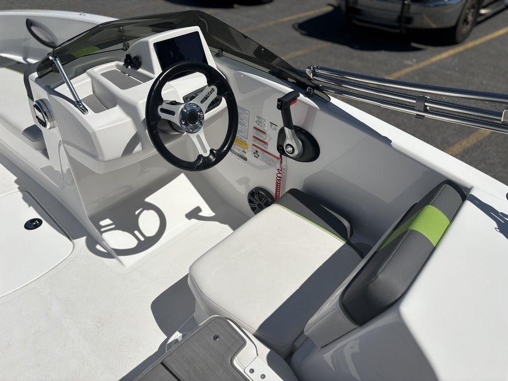 2024 Tahoe T16 boat interior with steering wheel and seating, showcasing modern design and functionality.