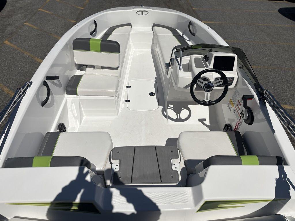 2024 Tahoe T16 boat interior with seating, steering wheel, and modern dashboard.