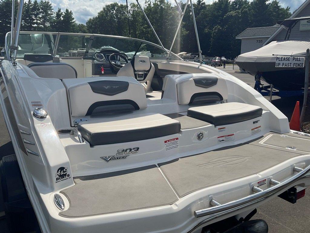 2018 Chaparral 203 VR boat with seating, docked outdoors on a sunny day.