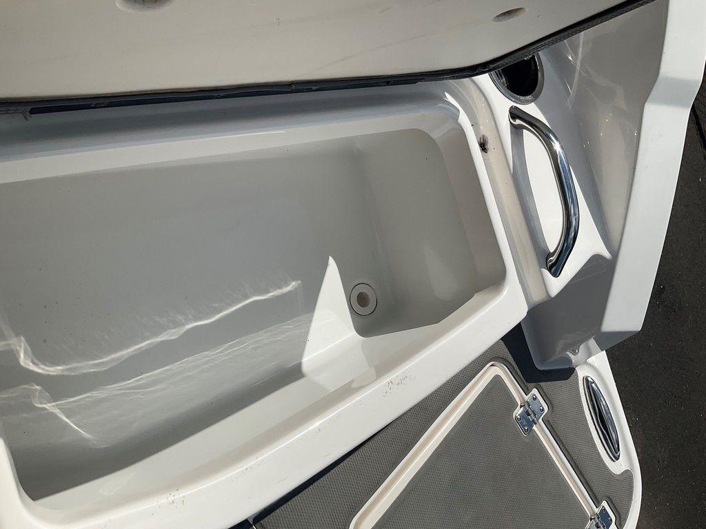 2018 Chaparral 203 VR boat storage compartment with stainless steel handle.
