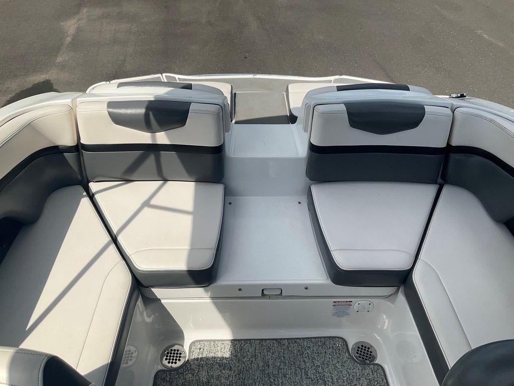 2018 Chaparral 203 VR boat interior with gray and white seating arrangement.