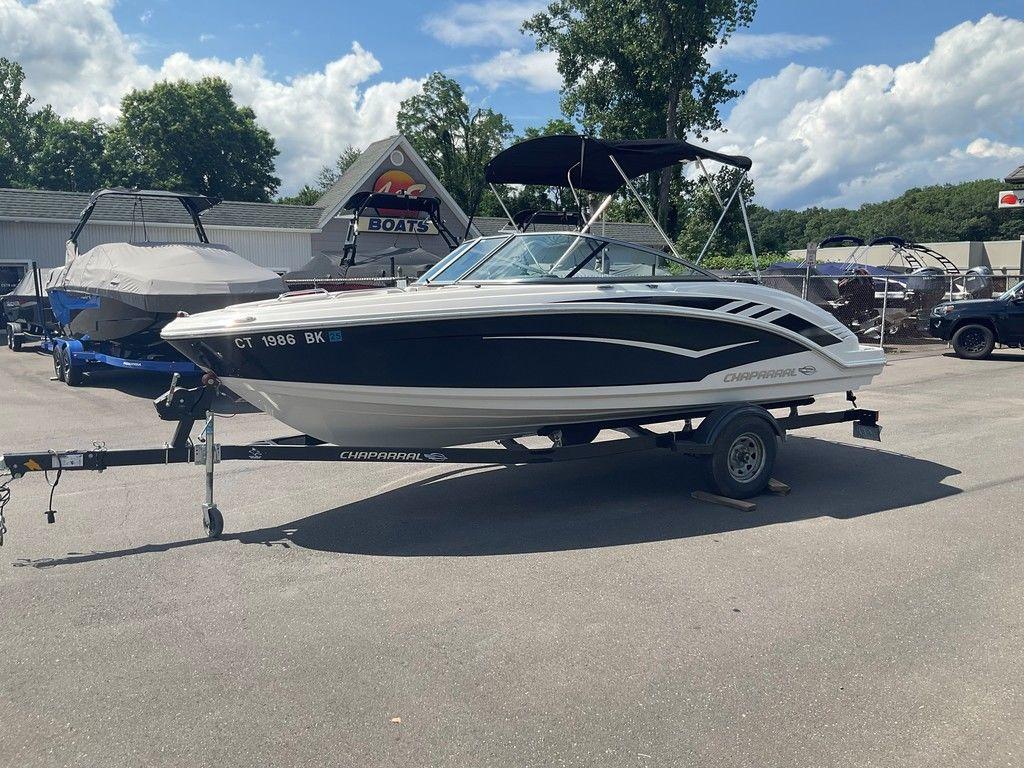 2018 Chaparral 203 VR boat on trailer in sunny outdoor setting.