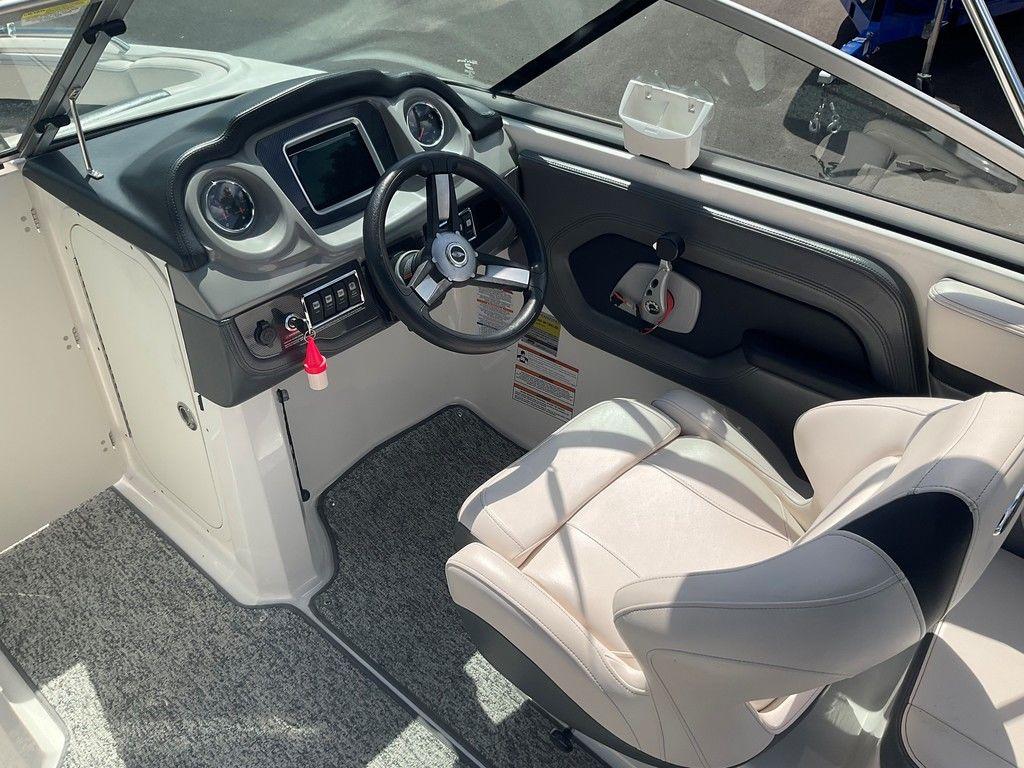 2018 Chaparral 203 VR boat interior with steering wheel and dashboard controls.