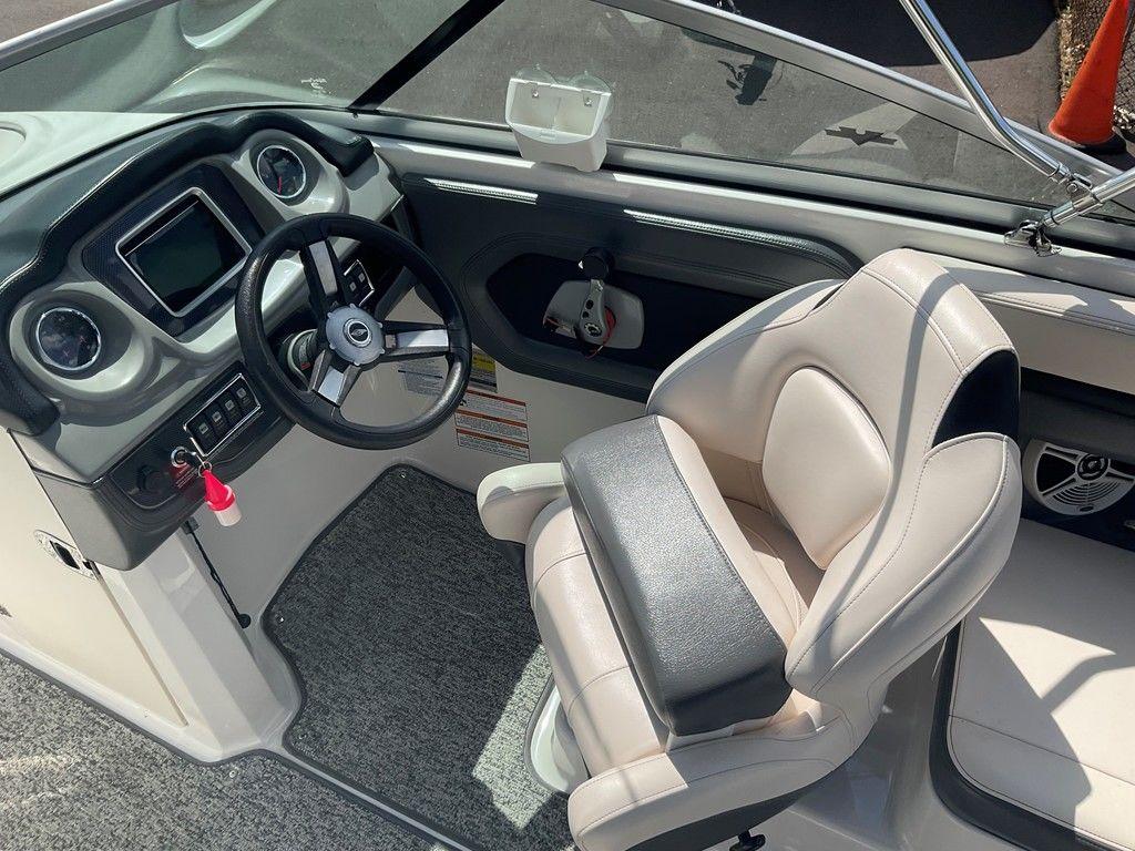 2018 Chaparral 203 VR boat interior with steering wheel and captain's seat.