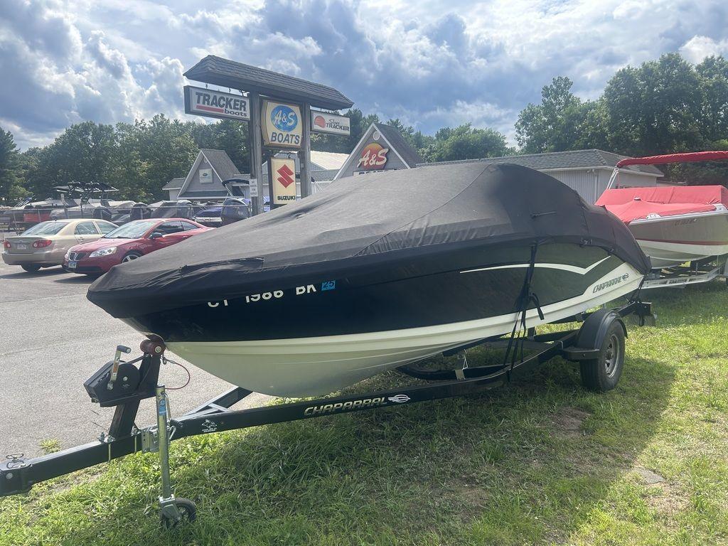 2018 Chaparral 203 VR boat covered on trailer at dealership lot.