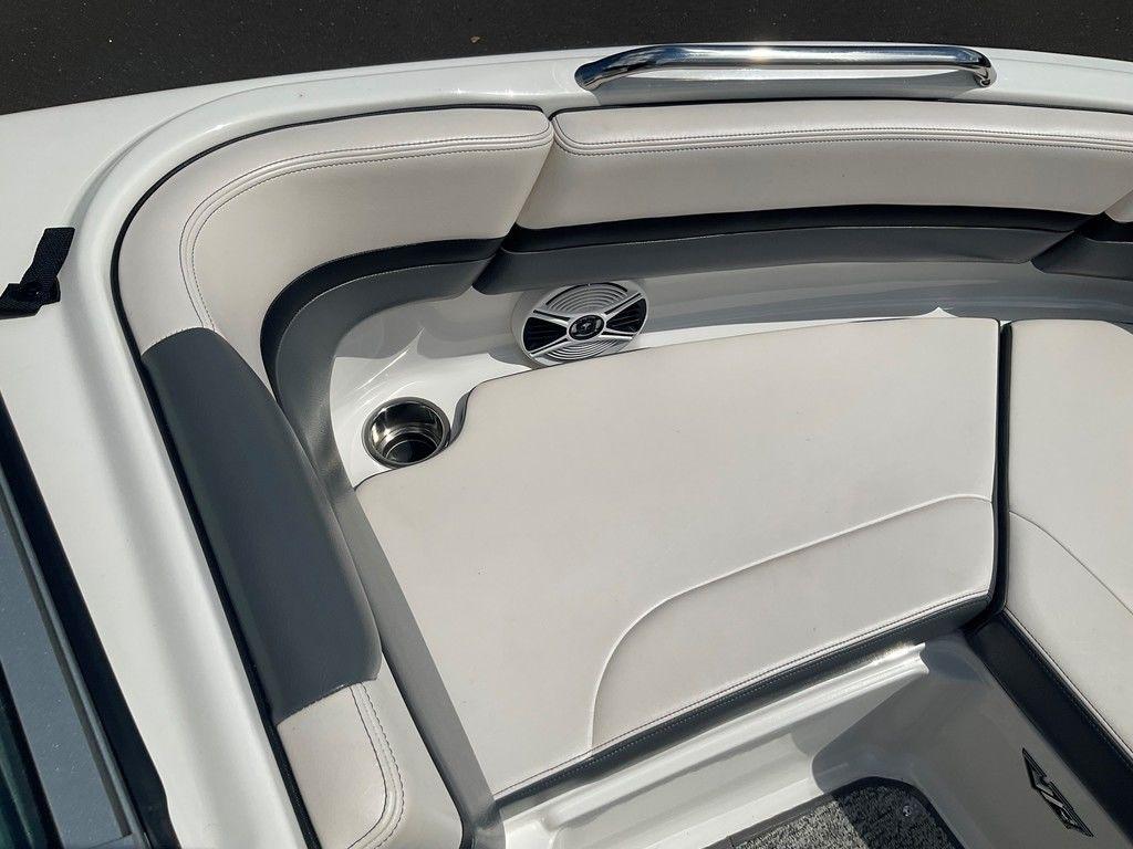 2018 Chaparral 203 VR boat interior with cushioned seating and speaker.