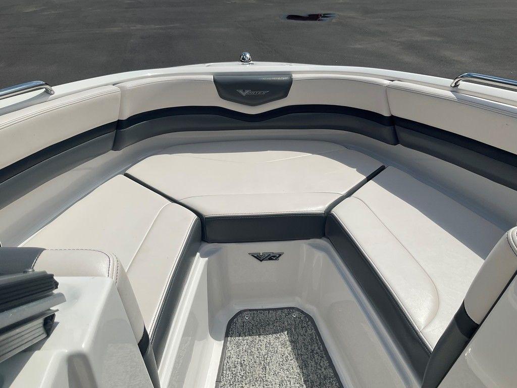 2018 Chaparral 203 VR boat interior with cushioned seating and sleek design.